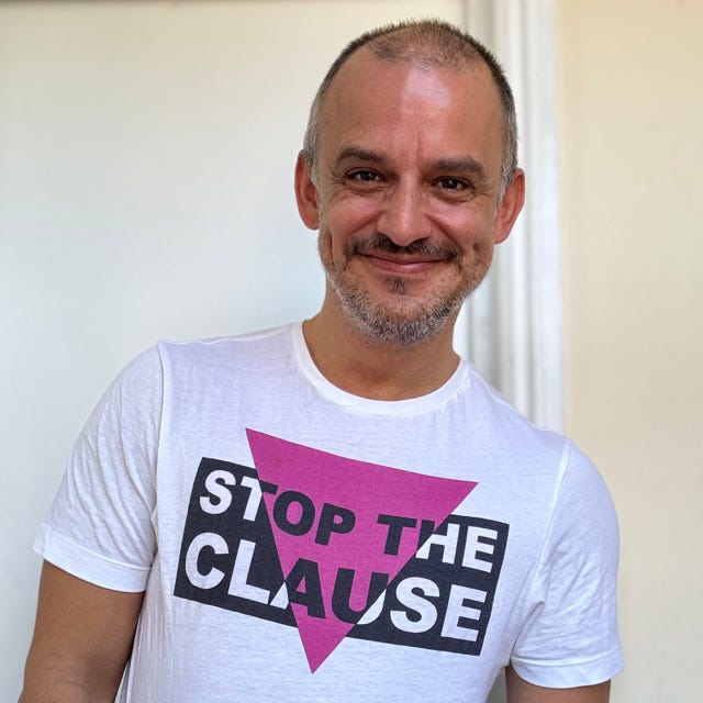 Philip Dehany wearing a 'Stop the Clause' T Shirt